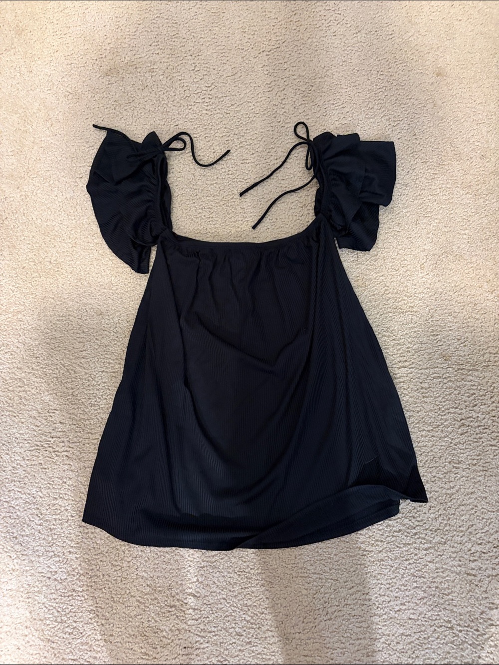 Woman’s black top